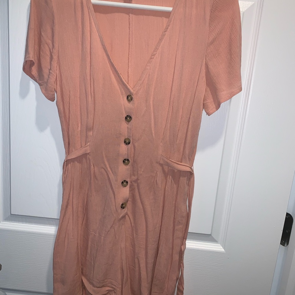 Worn once pink button romper with tie back